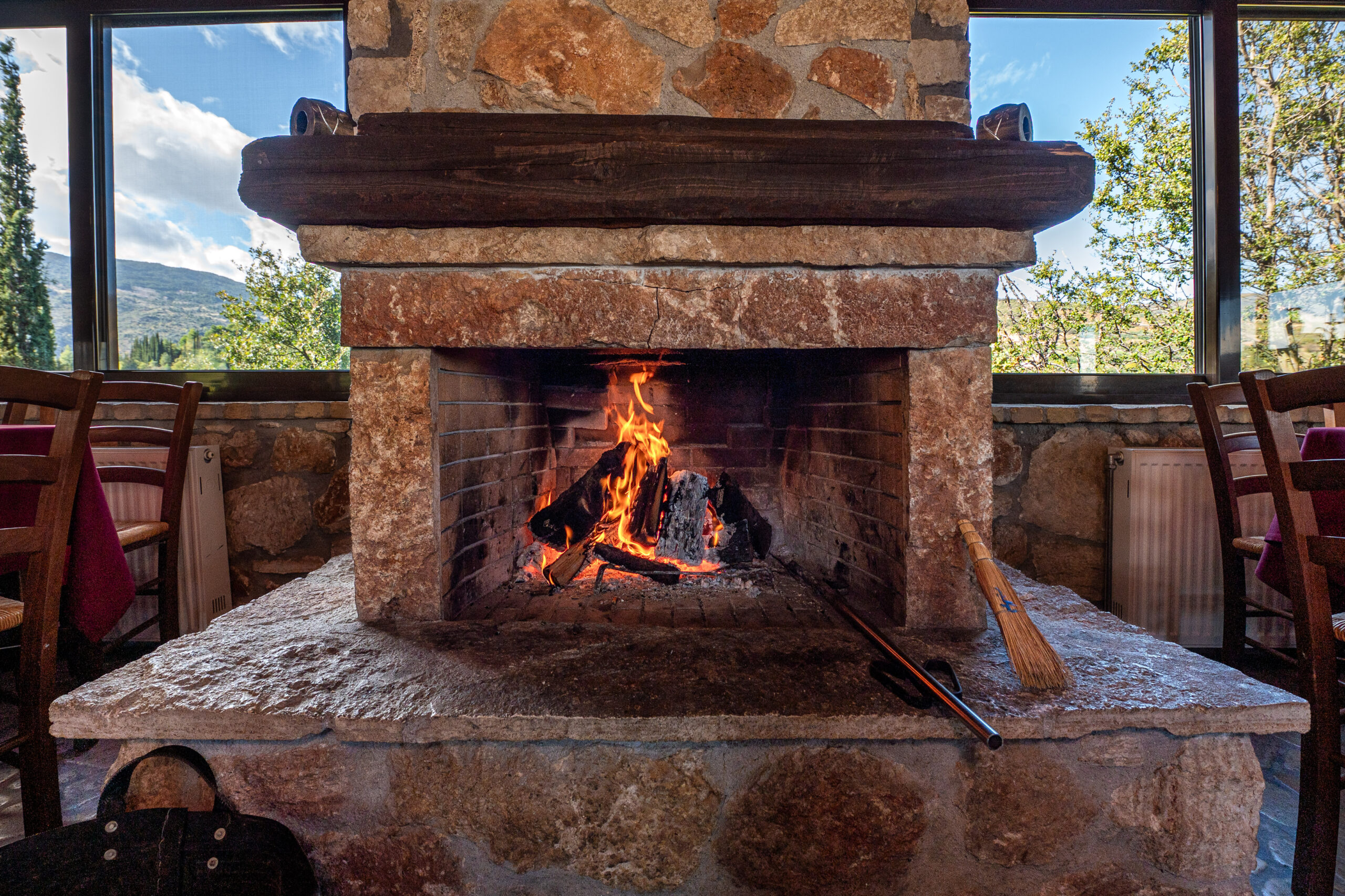 To Polychoro taverna in Trikala, Corinthia: charcoal grill and a fireplace since 2008 2 The fireplace at To Polychoro