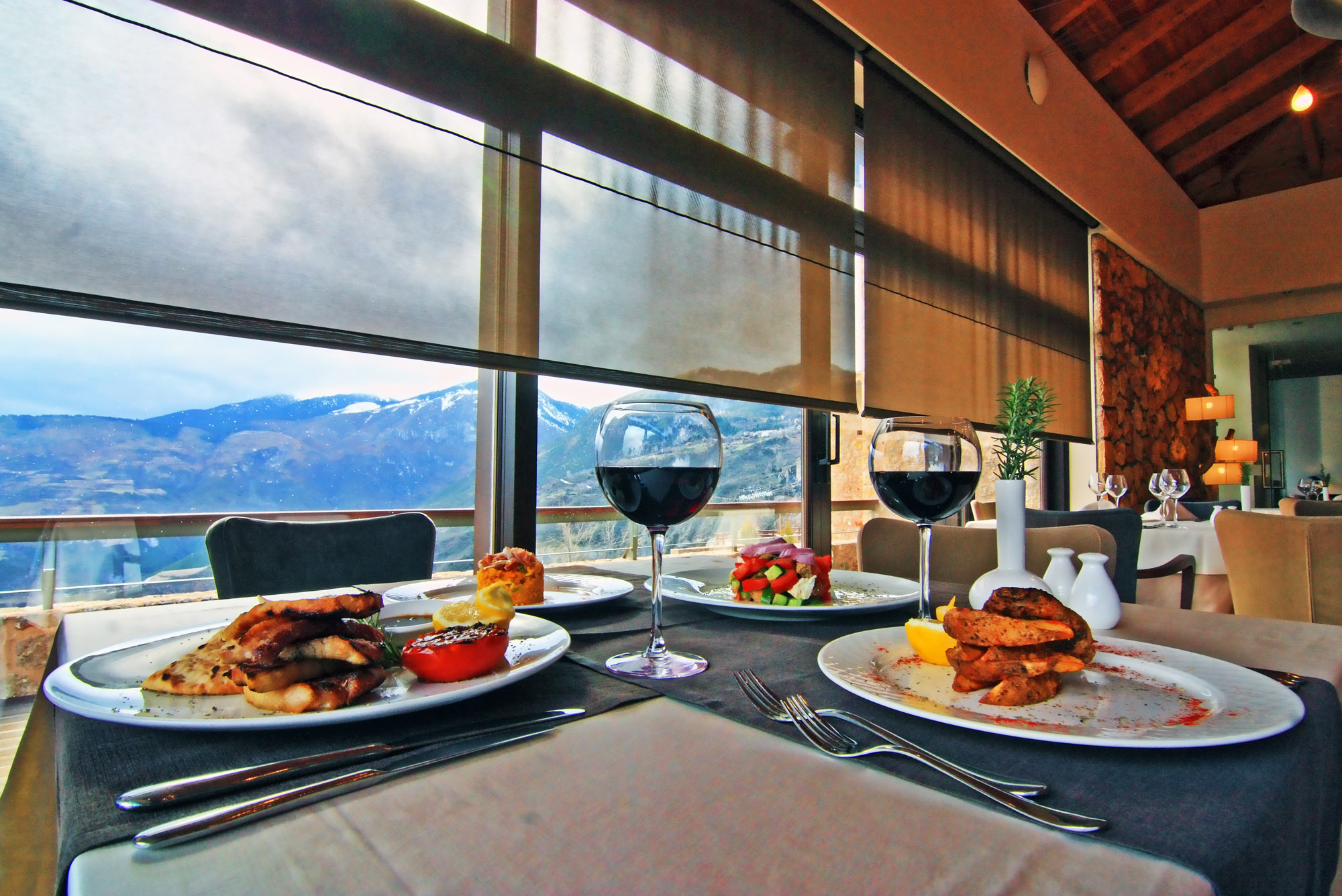The Pliadon Gi restaurant with a view of the snowy mountains