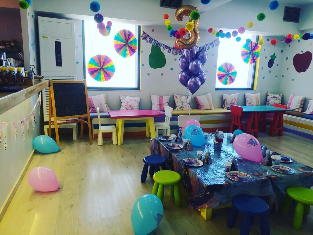 The room decorated with balloons for a birthday